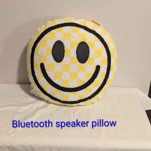 Iscream Yellow and Black Smiley Face Pillow With Bluetooth Speakers In The Eyes.
